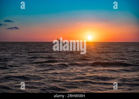 Beautiful nature scene of colorful sunset over ocean Stock Photo