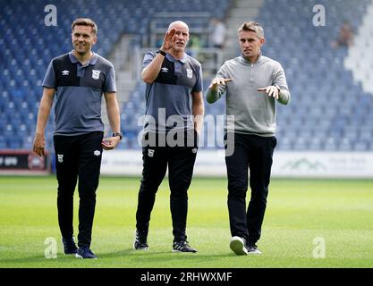 Ipswich Town manager Kieran McKenna (right) with assistant manager Martyn pert (centre) and analyst Charlie Turnbull prior to the Sky Bet Championship match at Loftus Road, London. Picture date: Saturday August 19, 2023. Stock Photo