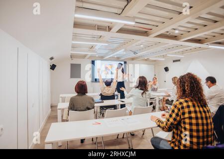 Age diverse group of businesspeople celebrating together at the conference room after their big success Stock Photo