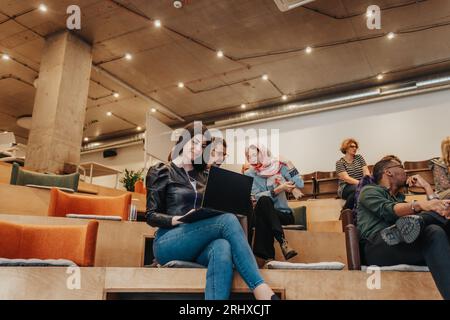 A photo of diverse group of business people working sales, marketing, discussing new business projects during brainstorming Stock Photo