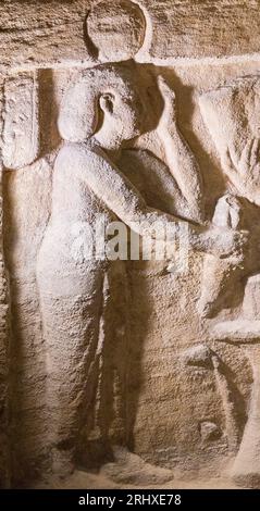 Kom el Shogafa necropolis, main tomb, main room, central niche, left wall : An unidentified female figure. Stock Photo