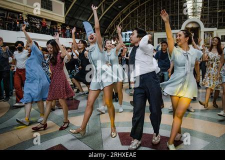 August 19, 2023, Bangkok, Bangkok, Thailand: August, 19 2023, People swing dancing during a vintage-themed swing dance party at Hua Lamphong railway station in Bangkok. Hundreds of Thai and foreign dance enthusiasts dressed in retro fashion style costumes and turned the passenger hall of Bangkok's century old railway station to a dancing floor of a 1930s-inspired swing dance party with swing jazz music aimed to promote the social dances. The swing dancing party is held by Bangkok Swing, a community of local and foreign swing dancers. (Credit Image: © Wissarut Weerasopon/ZUMA Press Wire) EDITOR Stock Photo