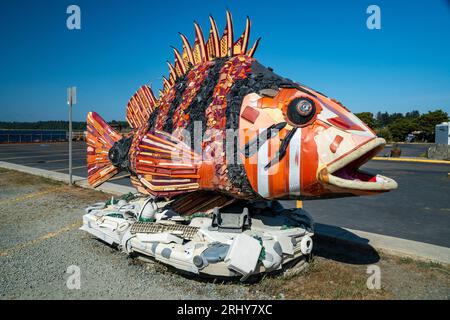 A beach art made from old fishing net and sea animal toys Stock