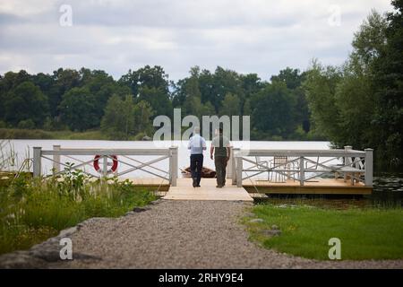 Flen, Sweden. 19th Aug, 2023. Swedish Prime Minister Ulf Kristersson, left, walks with Ukrainian President Volodymyr Zelenskyy, right, during a bilateral meeting at the traditional country of Harpsund, August 19, 203 in Flen, Sweden. Credit: Pool Photo/Ukrainian Presidential Press Office/Alamy Live News Stock Photo