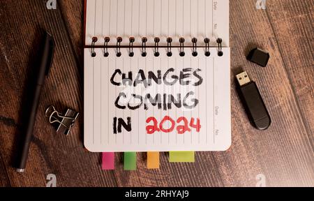 top view of page with text Changes coming in 2024 on yellow notepad. Stock Photo