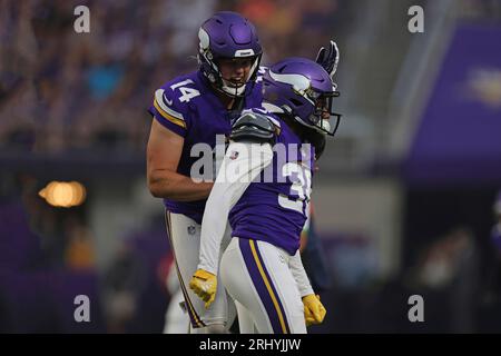 Minnesota Vikings cornerback NaJee Thompson (36) celebrates with punter Ryan  Wright (14) after a play against the Tennessee Titans during the first half  of an NFL football game Saturday, Aug. 19, 2023