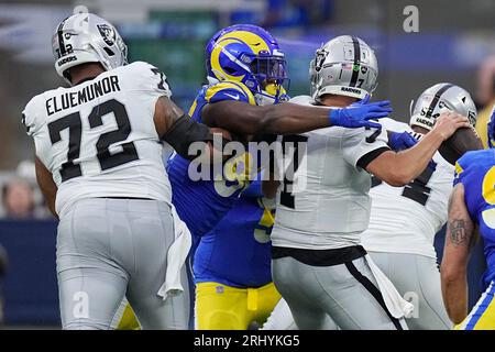 Los Angeles Rams linebacker Keir Thomas (96) and linebacker Jake Hummel  (59) run out of the tunnel before a preseason NFL football game against the  Cincinnati Bengals, Saturday, Aug. 27, 2022, in