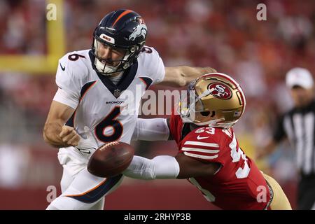 Los Angeles Chargers quarterback Max Duggan, right, gets away from San  Francisco 49ers linebacker Dee Winters during the second half of an NFL  preseason football game Friday, Aug. 25, 2023, in Santa