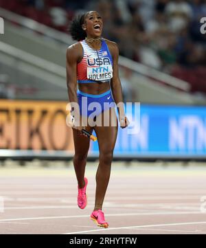 Budapest. 19th Aug, 2023. Alexis Holmes (L) of the United States runs to  the finish line as Femke Bol of the Netherlands falls over during the  4x400m Relay Mixed Final of the