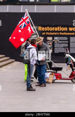 Melbourne, Australia, 19 August, 2023. Protesters with red ensign a flag used by right wing fringe groups during a small 'No Vote' rally on the steps of State Parliament in Melbourne, Australia 19 August 2023. Credit: Michael Currie/Speed Media/Alamy Live News Stock Photo