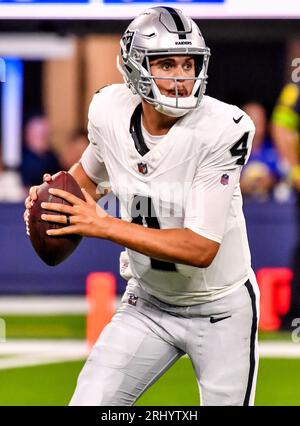 Las Vegas Raiders quarterback Aidan O'Connell (4) hands off the ball to ...
