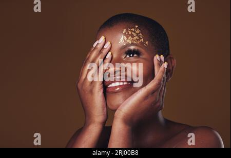 Cosmetics Portrait Black Woman Gold Makeup Brown Background Glitter Paint  Stock Photo by ©PeopleImages.com 671840874