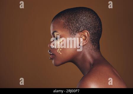 Cosmetics Portrait Black Woman Gold Makeup Brown Background Glitter Paint  Stock Photo by ©PeopleImages.com 671840874