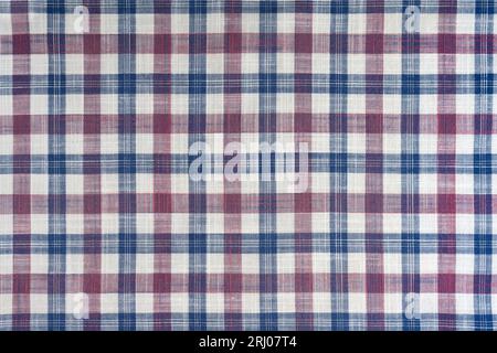 Blue and pink checkered texture fabric, tartan pattern. Shirt fabric, tablecloth textile, linen plaid cloth, classic scottish check pattern. Backdrop, Stock Photo