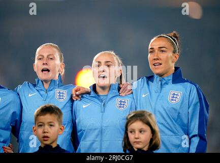 England's Keira Walsh, Georgia Stanway and Lucy Bronze during the national anthem ahead of the FIFA Women's World Cup final match at Stadium Australia, Sydney. Picture date: Sunday August 20, 2023. Stock Photo