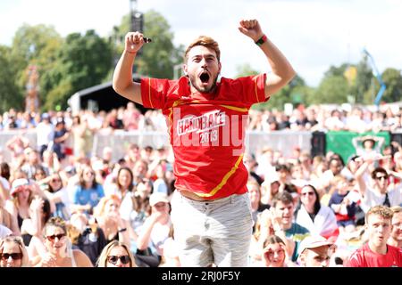 A Spain fan celebrates their side's first goal of the game, scored by Spain's Olga Carmona, during a screening of the FIFA Women's World Cup 2023 final between Spain and England at All Points East festival in Victoria Park, London. Picture date: Sunday August 20, 2023. Stock Photo