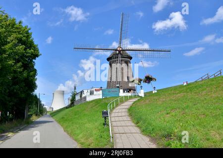 Catering facility 'De Molen' in the ghost town of Doel with behind it the nuclear power plant, which has recently caused great concern in the Zeeland Stock Photo