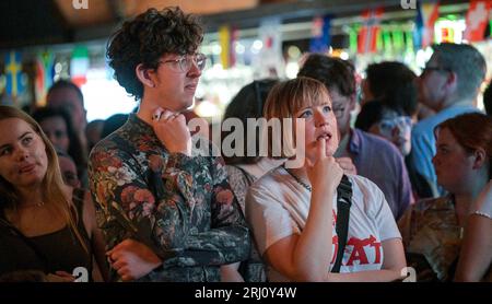 Brighton UK 20th August 2023 - Tense moments  as England fans watch the first half in the King & Queen pub in Brighton as England take on Spain in the Women's World Cup Final in Australia   : Credit Simon Dack / Alamy Live News Stock Photo