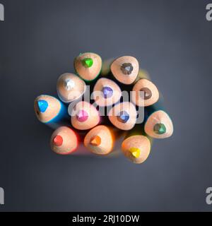 Top view of collection set of colored pencils crayons orderly aligned in a row, art or drawing equipment Stock Photo