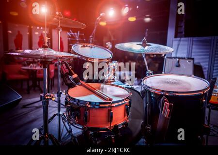 Drum on stage. Rock concert stage with musical instruments in nightclub Stock Photo
