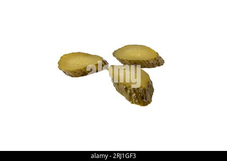 Three pieces of sliced marinated cucumber pickles isolated on white. Cooking ingredient. Stock Photo