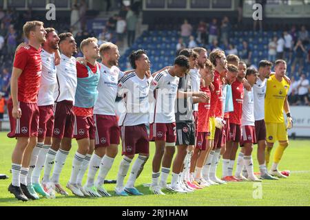 20 August 2023, Lower Saxony, Osnabrück: Soccer: 2nd Bundesliga, VfL Osnabrück - 1. FC Nürnberg, Matchday 3 at Stadion an der Bremer Brücke. Nuremberg's players celebrate the victory at the end of the match. Photo: Friso Gentsch/dpa - IMPORTANT NOTE: In accordance with the requirements of the DFL Deutsche Fußball Liga and the DFB Deutscher Fußball-Bund, it is prohibited to use or have used photographs taken in the stadium and/or of the match in the form of sequence pictures and/or video-like photo series. Stock Photo