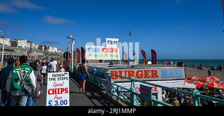 Brighton UK 20th August 2023 - Crowds enjoy the hot sunny weather on Brighton beach and seafront  as the South Coast enjoys the first nice weekend for a while  : Credit Simon Dack / Alamy Live News Stock Photo