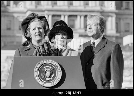 Prime Minister of Great Britain, Margaret Thatcher, speaking at a lectern, next to President of US Jimmy Carter and First Lady Rosalynn Carter.  In Washington, D.C.  17 December 1979. Stock Photo