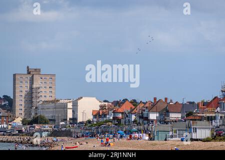 The Red Arrows can be seen at distance over the town of Herne Bay as they head to the Folkestone Airshow in 2023. Stock Photo