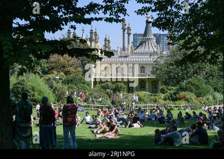 Brighton UK 20th August 2023 - Crowds enjoy the hot sunny weather in Brighton's Royal Pavilion Gardens as the South Coast enjoys the first nice weekend for a while  : Credit Simon Dack / Alamy Live News Stock Photo