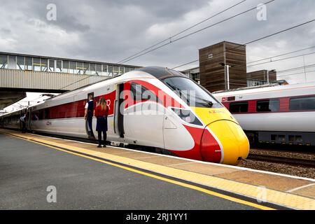 PETERBOROUGH, UK - AUGUST 18, 2023.  A high speed Hitachi Azuma AT300 Intercity passenger trains in LNER livery ready to depart from the platform at P Stock Photo