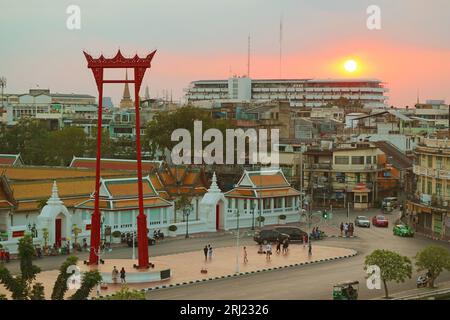 Spectacular Aerial View of Sao Ching Cha Giant Swing and Wat Suthat Thepwararam Temple at Sunset, Bangkok Old City, Thailand Stock Photo