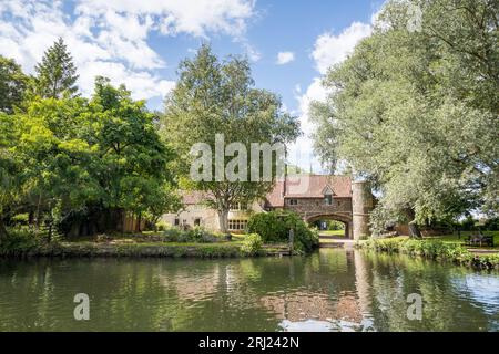 Pulls Ferry, a 15th century ferry house and water gate seen on the River Wensum in Norwich in August 2023. Stock Photo