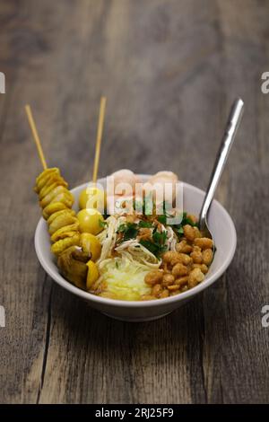 Bubur ayam, an Indonesian chicken congee. breakfast staple. Stock Photo