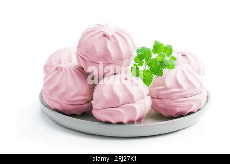 Pink  marshmallows on ceramic plate isolated on white Stock Photo