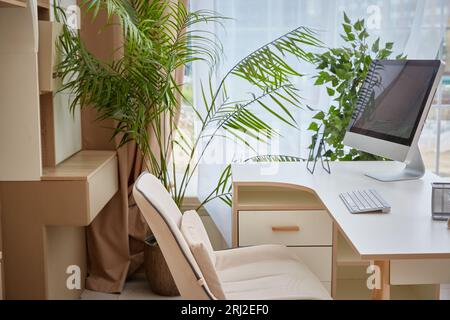 Digital, laptop and black screen mock up on table surface in office building for marketing, design and frame. Desktop, monitor and online with creativ Stock Photo