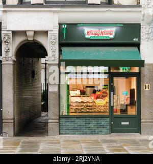 London, UK - July 31, 2023; Facade and sign of Krispy Kreme store on the Strand in London Stock Photo