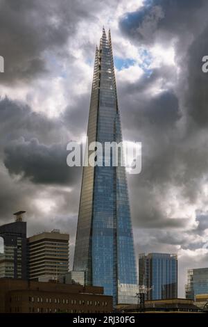 London, UK - July 28, 2023; The Shard skyscraper against stormy summer sky in London Stock Photo