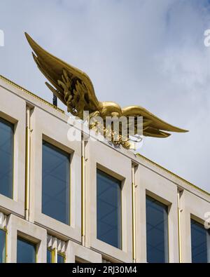 London, UK - July 30, 2023; Large golden eagle artwork by Theodore Roszak atop the former American Embassy in London Stock Photo