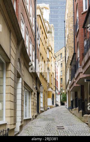 London, UK - July 31, 2023; View along ancient Lovat Lane EC3 in City of London with sett pavement Stock Photo