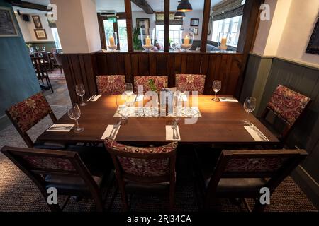 A sophisticated and stylish table setting featuring a collection of wine glasses and place mats with decorative place cards Stock Photo