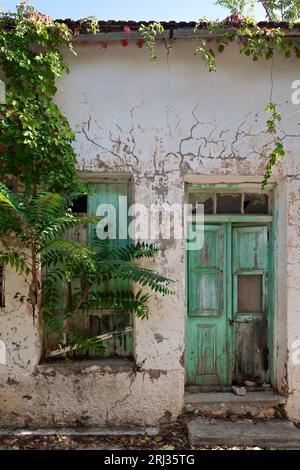 Facade of an old, abandoned traditional house at the picturesque village of Fourni, in the mountainous region of Merambello in Lasithi region, Crete. Stock Photo