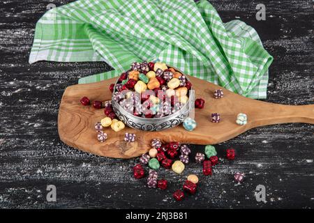 Milk chocolate candies in shell with jelly sugar gums and liquorice allsorts and fruit sherbet candies. with marshmallows and strawberry bon bons. Stock Photo