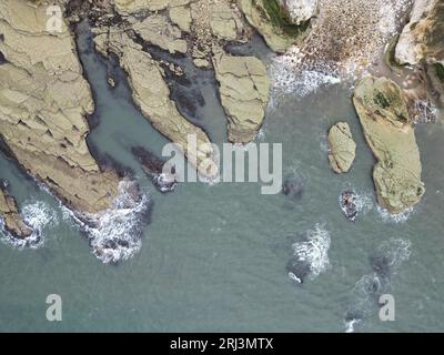 Aerial view of Thornwick Bay on the Yorkshire Coast in England, showcasing the idyllic scenery of the rugged coastline Stock Photo