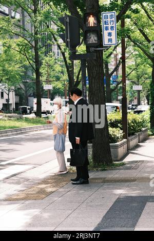 Asian people wearing medical masks during Coronavirus epidemic outbreak ...