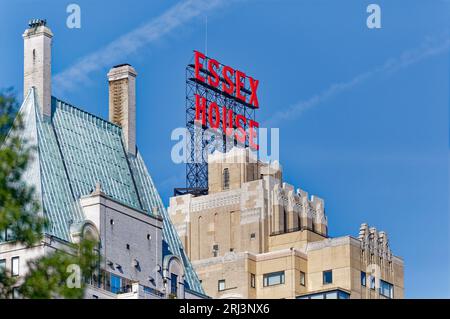 You can’t miss the giant red neon Essex House sign facing Central Park. Staid Hampshire House, apartments, are at left. Stock Photo