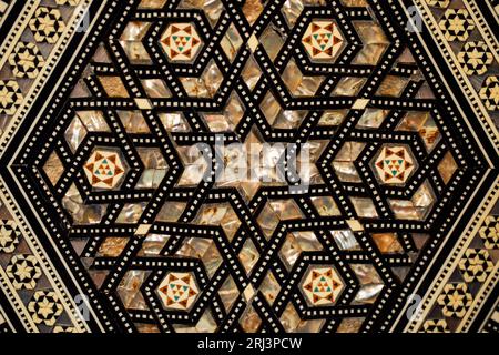 A vibrant graphic pattern displayed on a black background, featuring intricate geometric designs Stock Photo