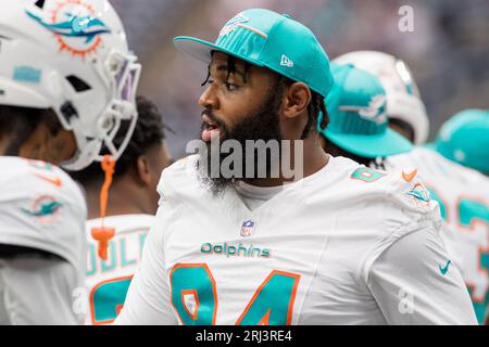 Miami Dolphins defensive tackle Christian Wilkins (94) laughs on the  sidelines during an NFL football game against the Philadelphia Eagles,  Saturday, Aug. 27, 2022, in Miami Gardens, Fla. (AP Photo/Doug Murray Stock