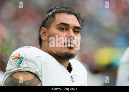 Miami Dolphins defensive tackle Brandon Pili (96) celebrates after making a  tackle during the second half of a preseason NFL football game against the  Atlanta Falcons, Friday, Aug. 11, 2023, in Miami