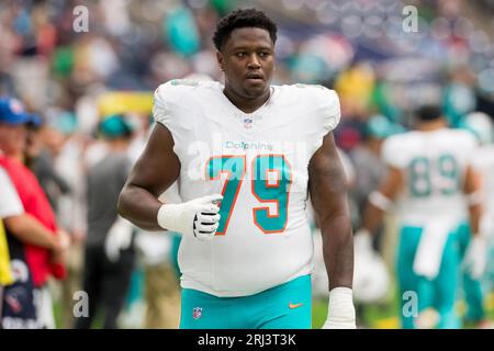 Miami Dolphins offensive tackle James Tunstall (75) reacts after an NFL ...